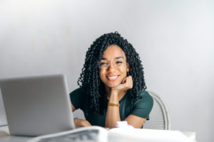 woman smiling working at computer